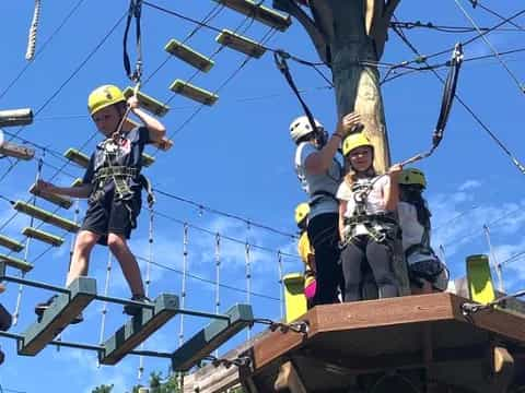 a group of people on a wooden structure