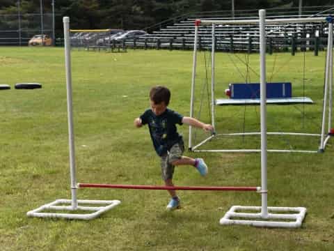 a boy playing with a frisbee