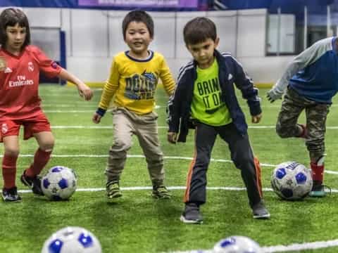 kids playing football on a field