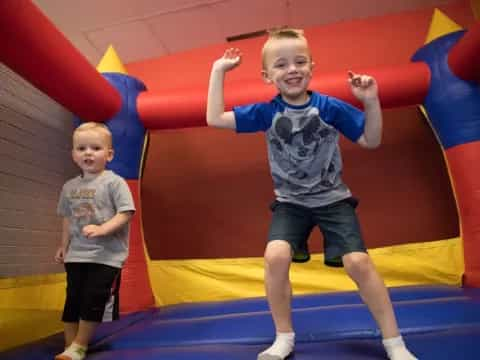 a couple of kids in a play area