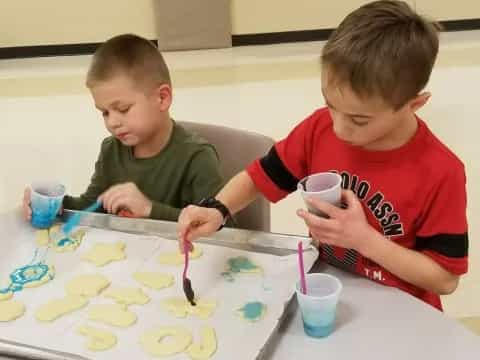a couple of boys painting