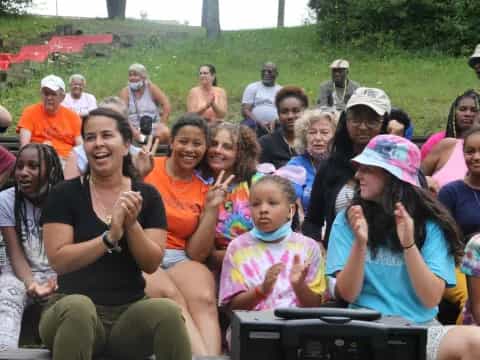 a group of people sitting outside