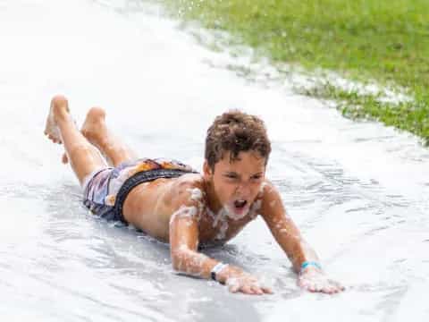 a boy playing in the water
