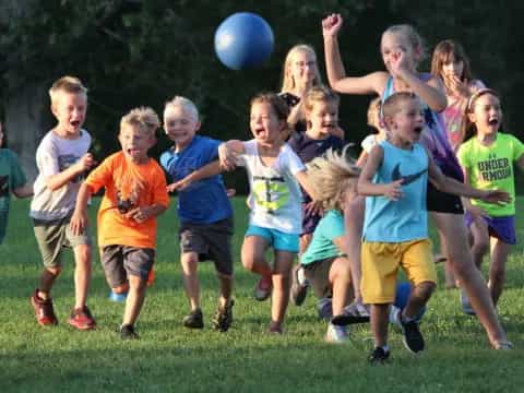 a group of kids playing with a ball