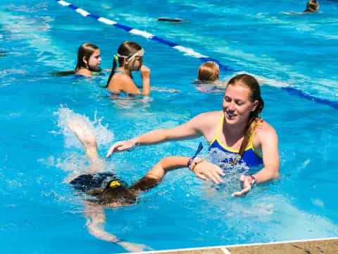 a group of women in a pool