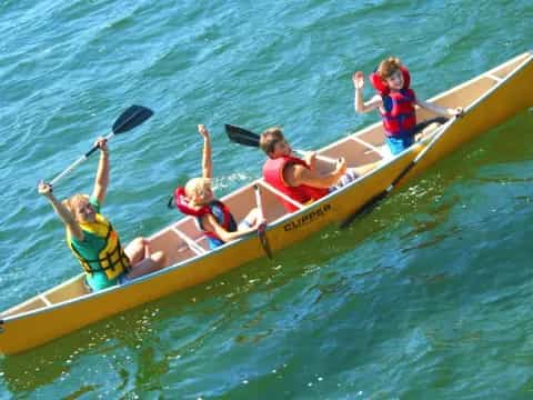 a group of people in a canoe