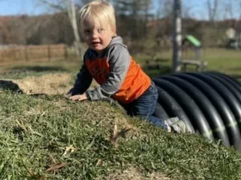 a child playing in the grass