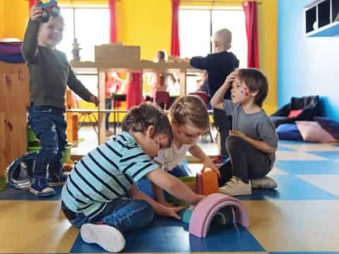 a group of kids playing with toys