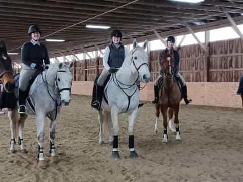 a group of people riding horses