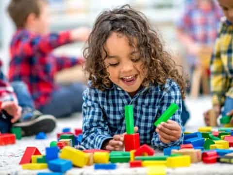 a young girl playing with toys
