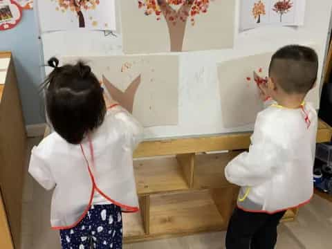 a couple of kids playing with a toy