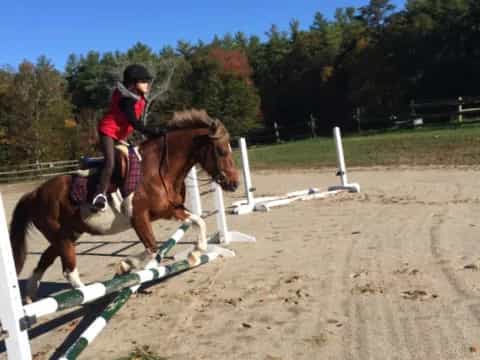 a girl riding a horse