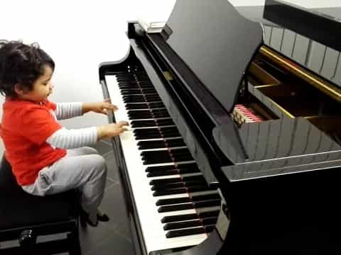 a child playing a piano