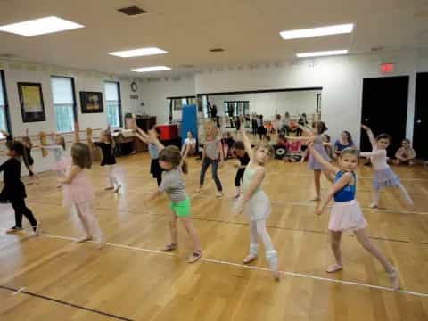 a group of girls dancing in a gym
