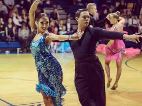 a man and woman dancing