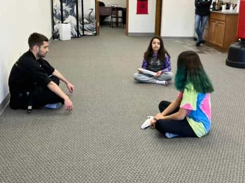 a group of people sitting on the floor