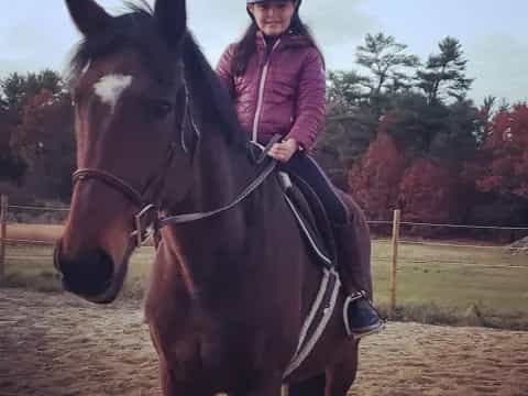 a woman riding a horse