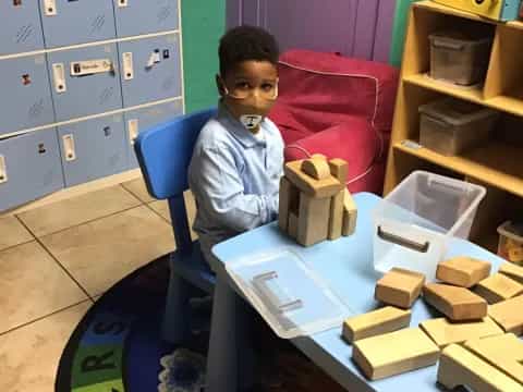 a boy sitting at a table