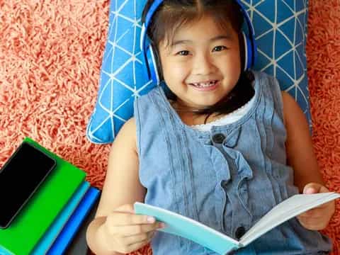 a girl holding a tablet