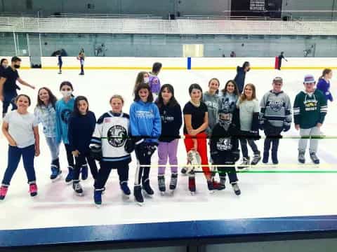 a group of people on an ice rink