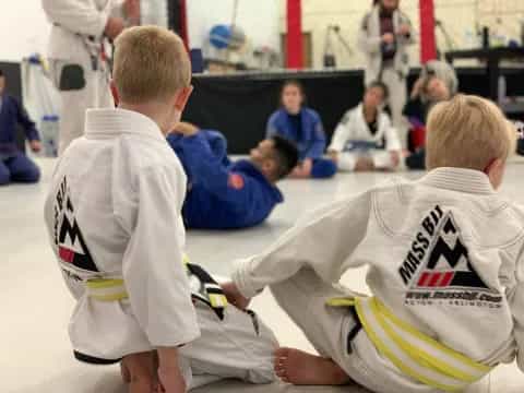 a group of boys in white shirts