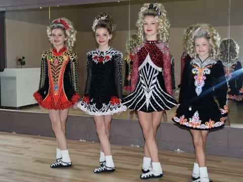 a group of girls in dresses