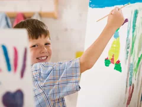 a young boy painting