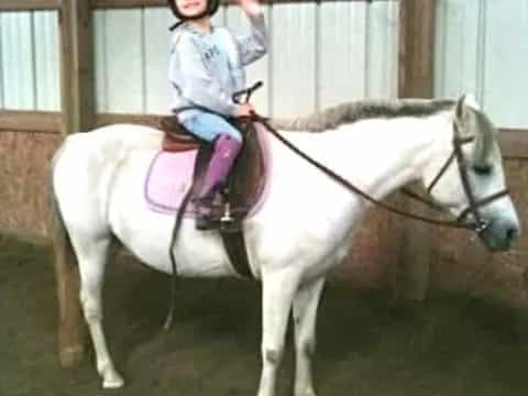 a girl riding a horse