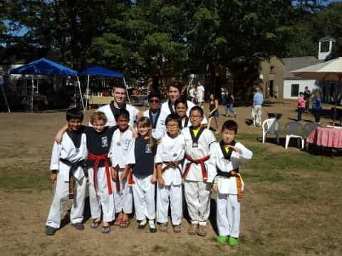 a group of boys in karate uniforms