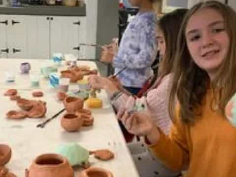 a person and a child in a kitchen