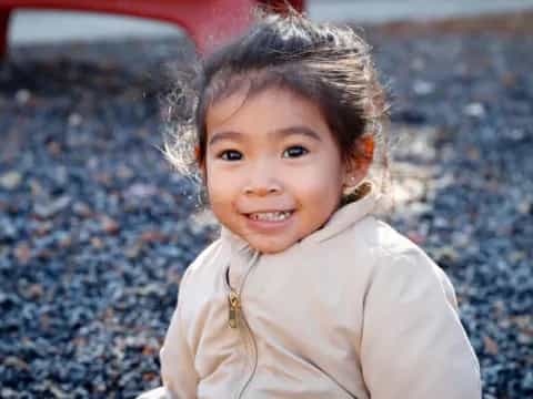 a girl smiling at the camera