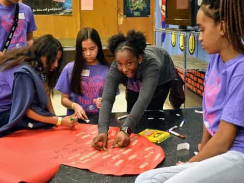 a group of people painting