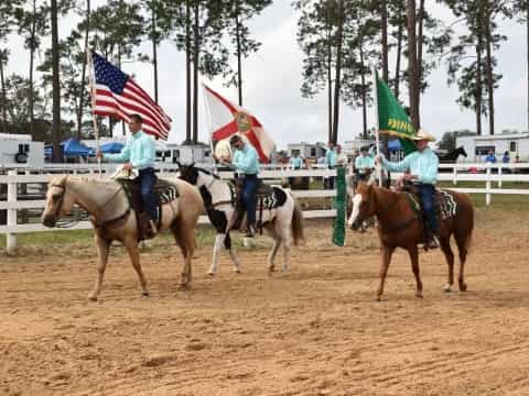 a group of people riding horses