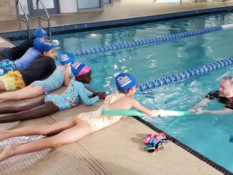 a group of people in a pool