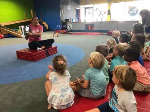 a person teaching a group of children