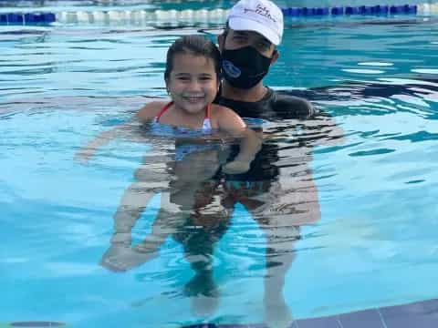 a man and woman in a pool