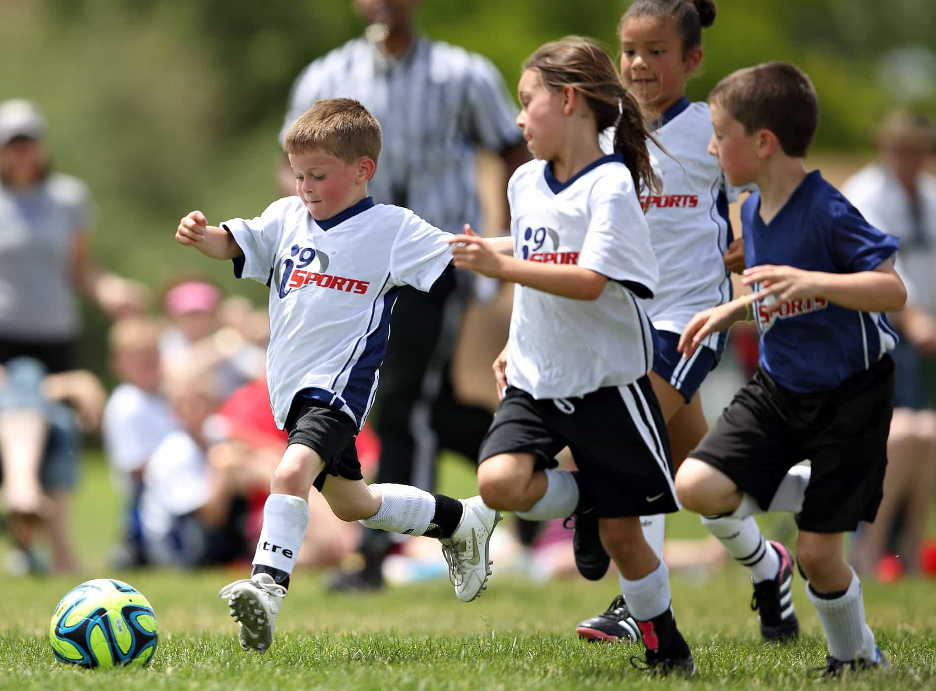 kids playing football on a field