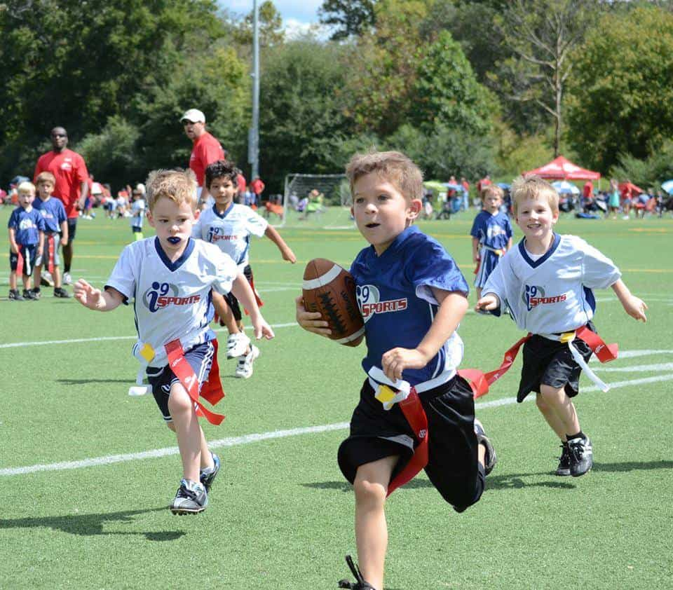 a group of kids playing baseball