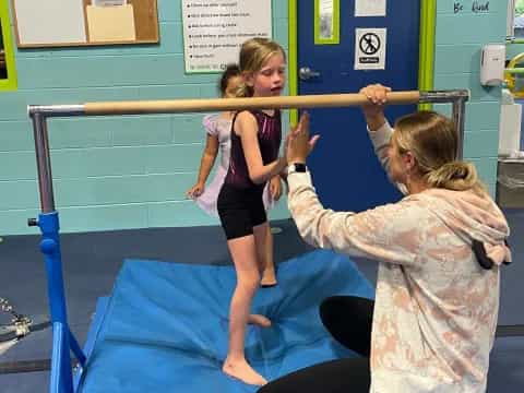 a woman standing on a bar