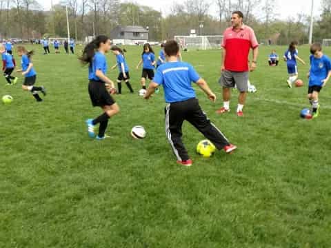a group of kids playing football