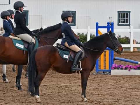 a group of people riding horses