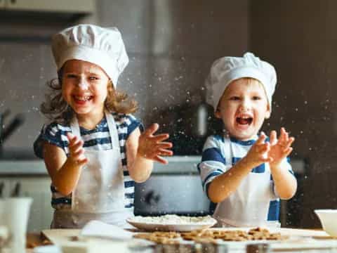 a few kids wearing hard hats