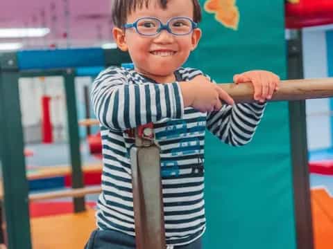 a boy holding a toy sword
