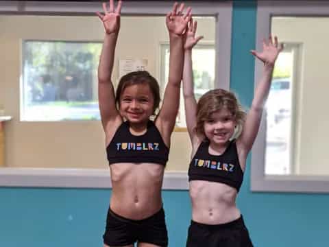 a couple of girls in a gym