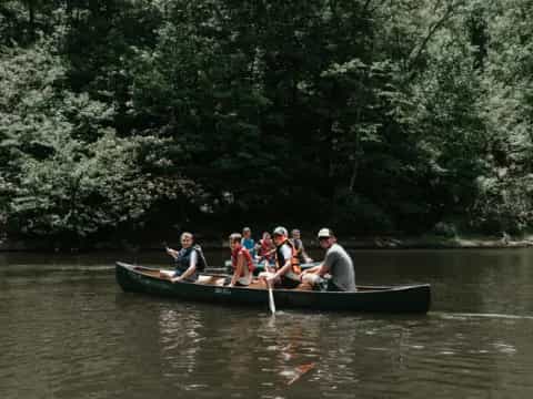 a group of people rowing a boat