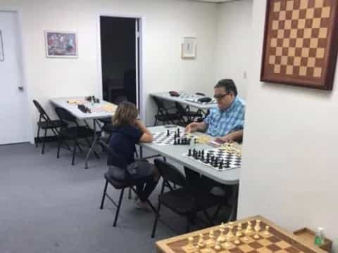a man and a woman playing chess
