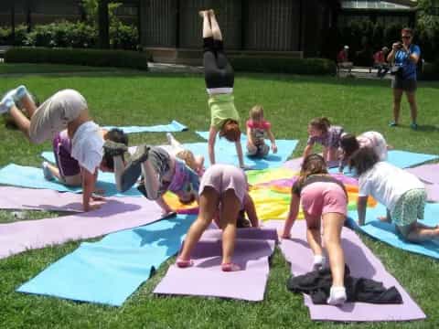 a group of children doing yoga