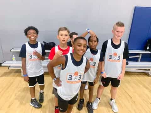 a group of boys wearing numbers