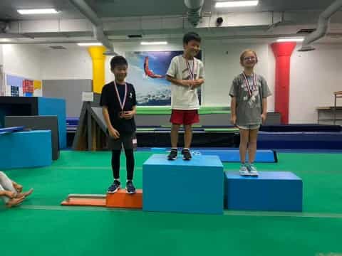 a group of boys wearing medals
