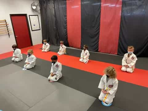 a group of children sitting on the floor